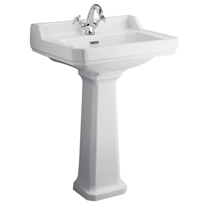 vitt tvättställ i porslin med ett blandarhål på piedestal