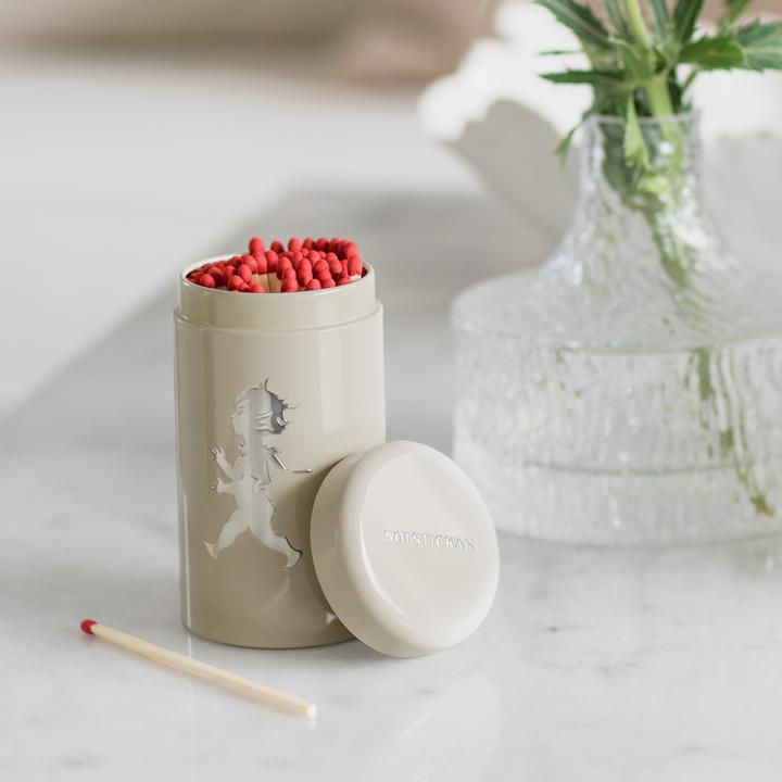 Solstickan tändsticksrör sand