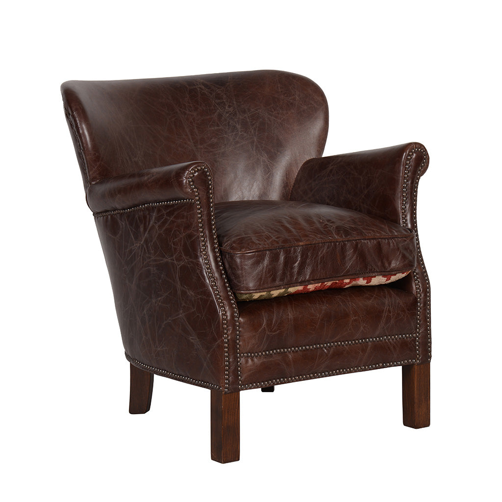 Fåtölj i brunt skinn, modell Professor från Artwood